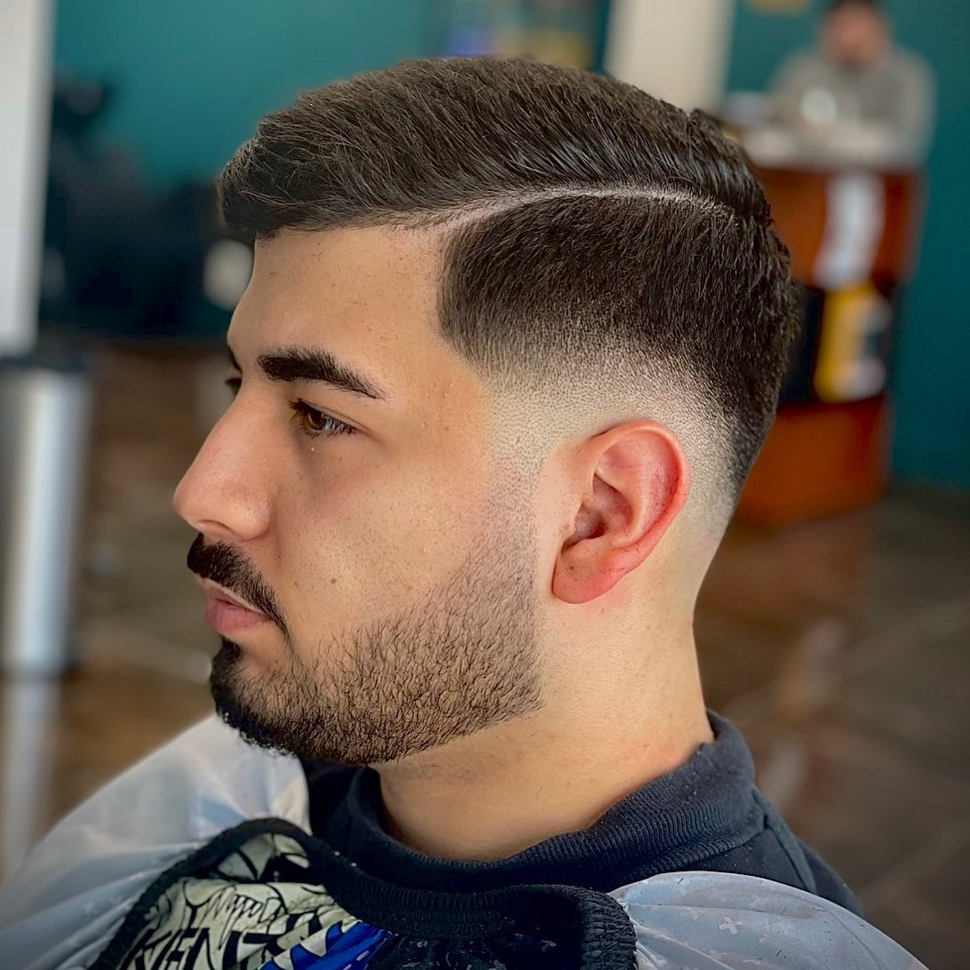 Fade haircut met overloop